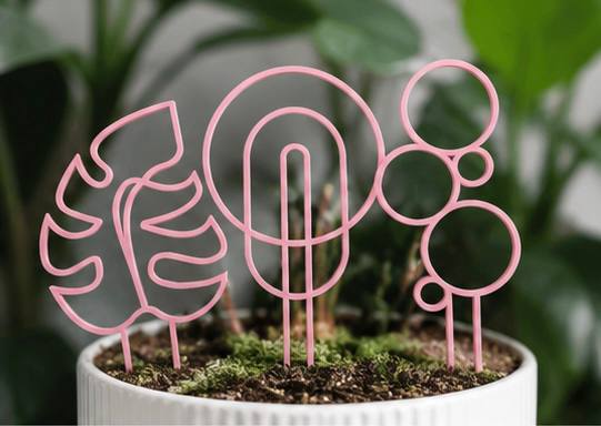 Detroit Plant Mom pink 3D printed plant trellis 3 pack supporting a potted houseplant