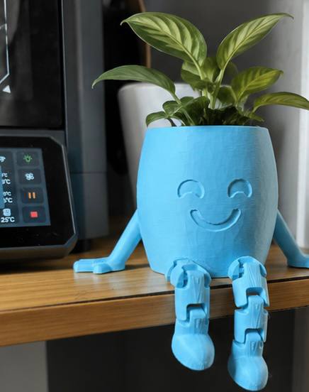 Detroit Plant Mom blue 3-inch 3D printed Hanging Buddy planter perched on a shelf with articulated legs dangling