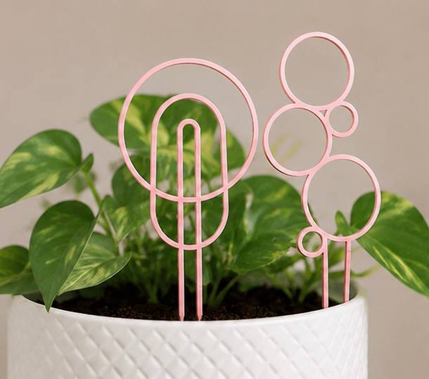 Detroit Plant Mom 3D Printed Circular Plant Trellis 4 Pack — pink trellises styled in a houseplant pot